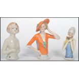 A group of three early 20th century possibly German or Austrian bisque ceramic figures in the female