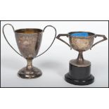 A silver hallmarked trophy / cup bearing the inscription Wing Nam Cup together with another silver