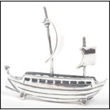 An unusual contemporary novelty cast silver figure of a viking ship ( see illustrations )