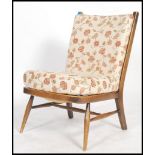 An Ercol ' Windsor ' pattern beech wood open framed chair - armchair. Raised on turned legs with