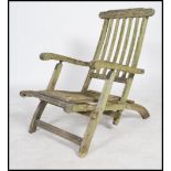 A vintage 20th century teak metamorphic folding chair lounger with label for Firman Leisure