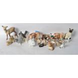 A collection of ceramic animals to include a Beswick Reindeer, Hornsea, SylvaC, USSR etc. Please see