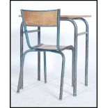 A school desk of French origin having tubular metal frame, dating to the 1970's together with a