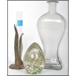 A group of three glass items to include an early pressed glass bottle, a solifleur vase and a dump