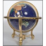 A large 20th century spherical globe having Lapis Lazuli inlay and inset semi precious stone