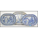 A collection of 3 blue and white willow pattern meat platters to include Staffordshire Stone Ware