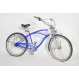 A vintage 20th century fixed speed two tone blue and white beach cruiser bike / bicycle by Dyno