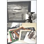 A collection of vintage over sized photographs dating from the mid century depicting various