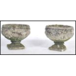 A pair of vintage stoneware garden planters / urns having floral swag decoration raised on square