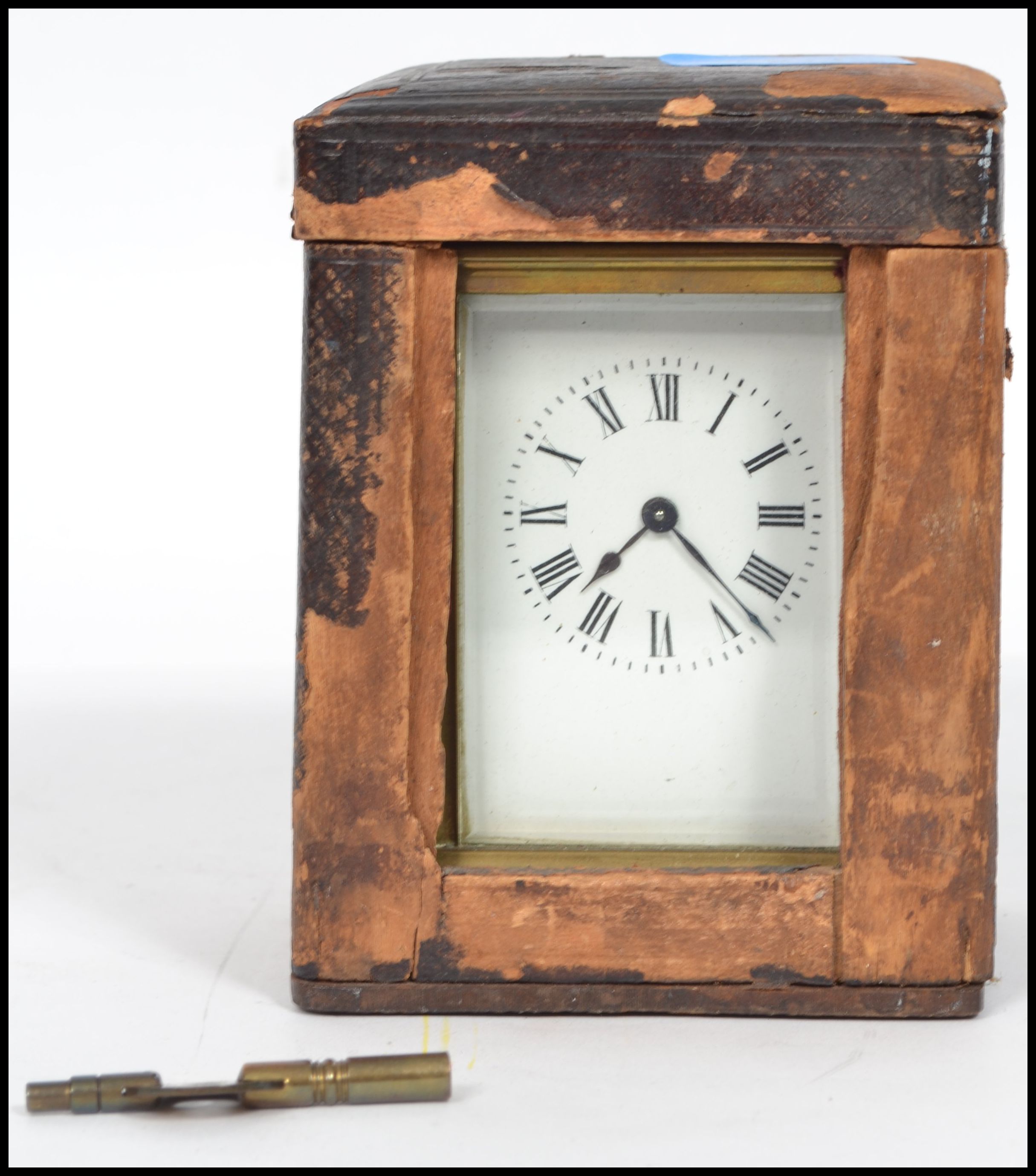 A late 19th century French  century brass cased carriage clock, in a leather carrying case, with