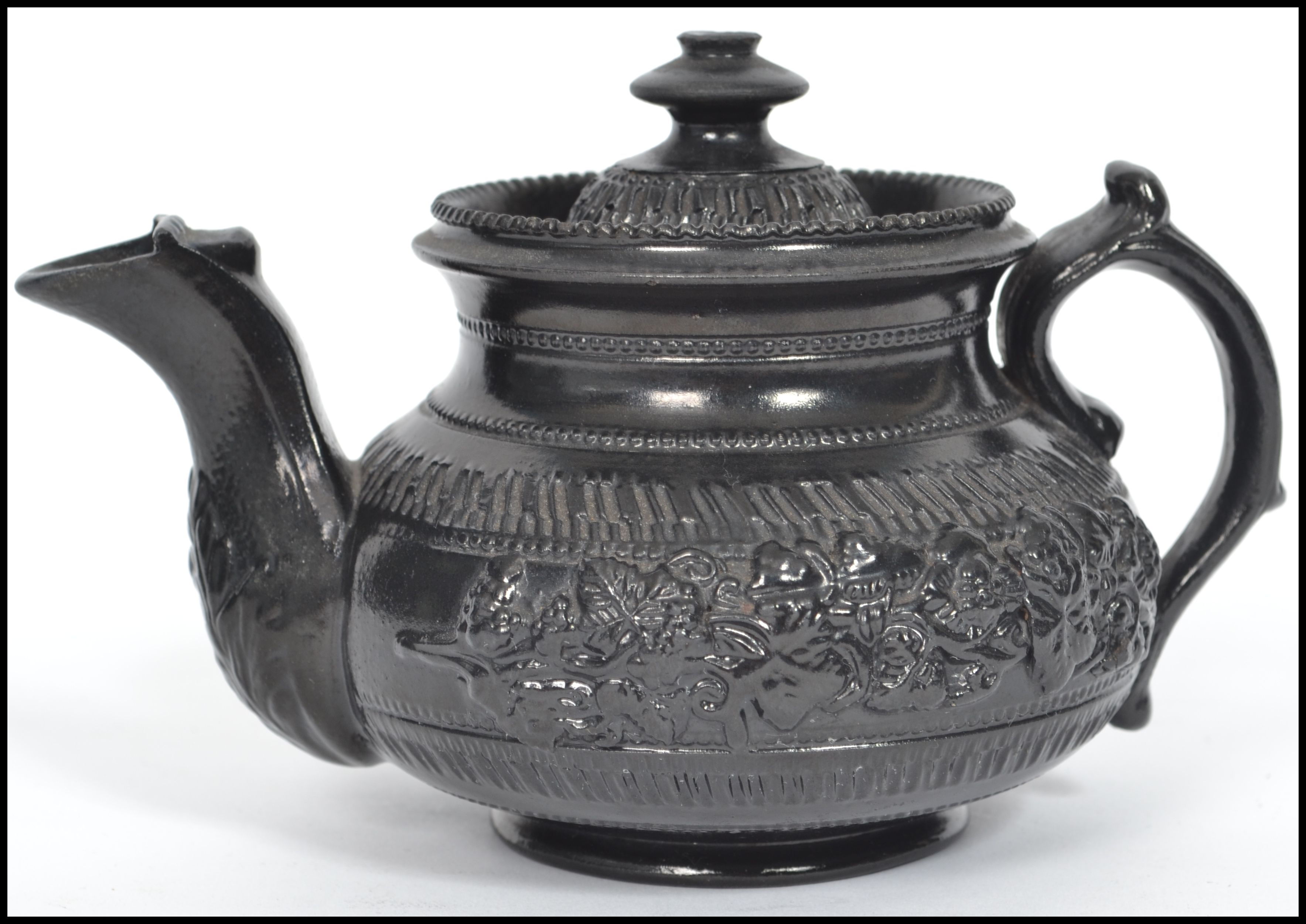 A possibly Wedgwood 19th century Victorian black basalt caneware (cane wear) ceramic teapot of