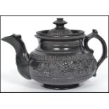 A possibly Wedgwood 19th century Victorian black basalt caneware (cane wear) ceramic teapot of