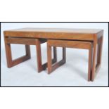 A vintage retro 20th century Danish influence tile top coffee table of rectangular form with two