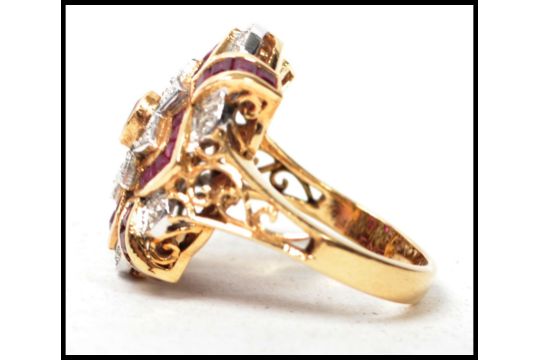 An 18ct yellow gold ladies ruby and diamond ring complete in the