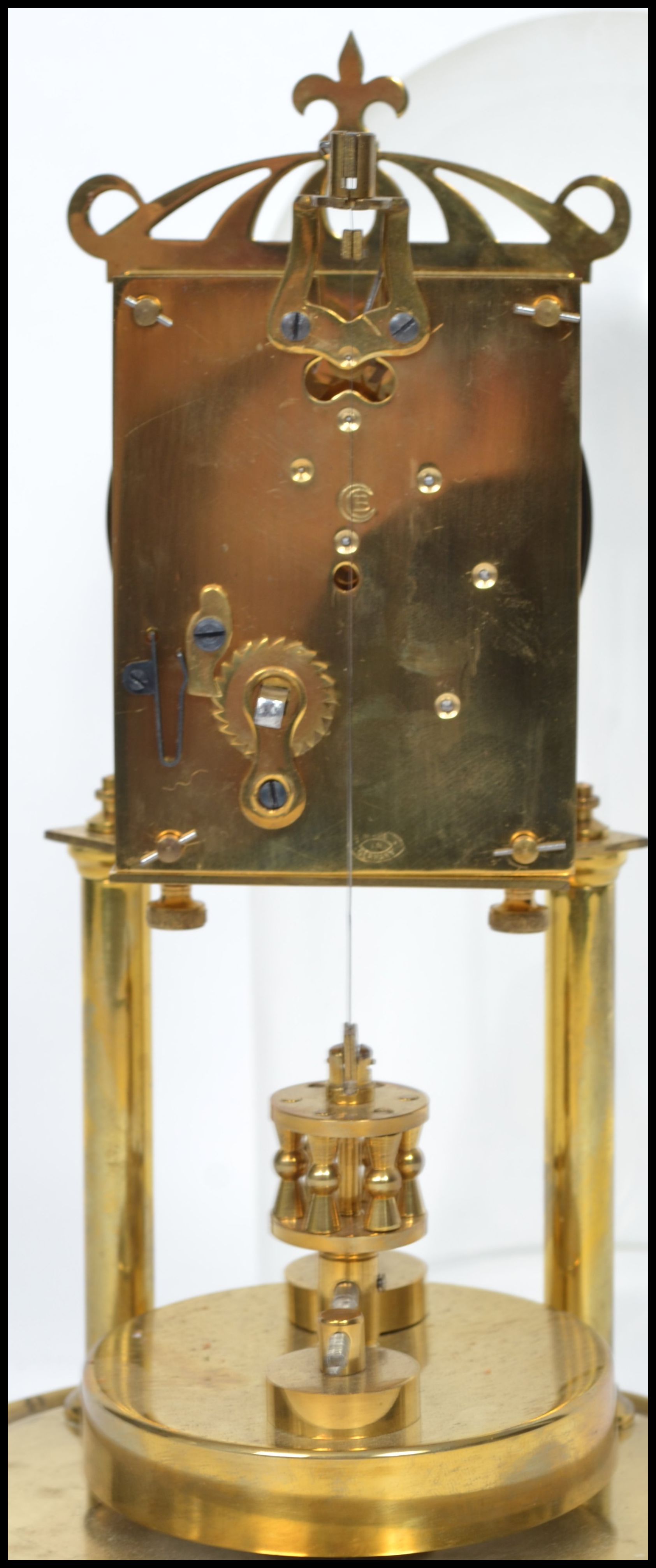 A 20th century glass domed brass anniversary clock raised on a stepped circular base with twin - Image 3 of 4