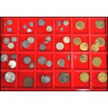 A collection of vintage antique coins and tokens to include Roman, English, Polish, Dutch, Papal