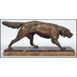 C. Masson: A 20th century bronze figurine of a retriever dog raised on a stepped two tone marble