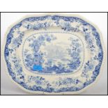 A large Victorian blue and white meat platter having classical scene to the centre being marked to