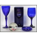 A group of Bristol Blue glass to include wine glasses goblets paperweights etc. Tallest measures