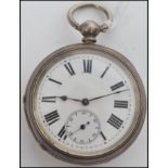 An early 20th century open faced silver pocket watch having key wind movement, enamel faced with