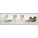 A group of six mid century made in USSR ceramic figurines to include a pair of terrier dogs a