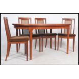 A retro 20th century teak D-end extending dining table by Mcintosch together with four G plan high