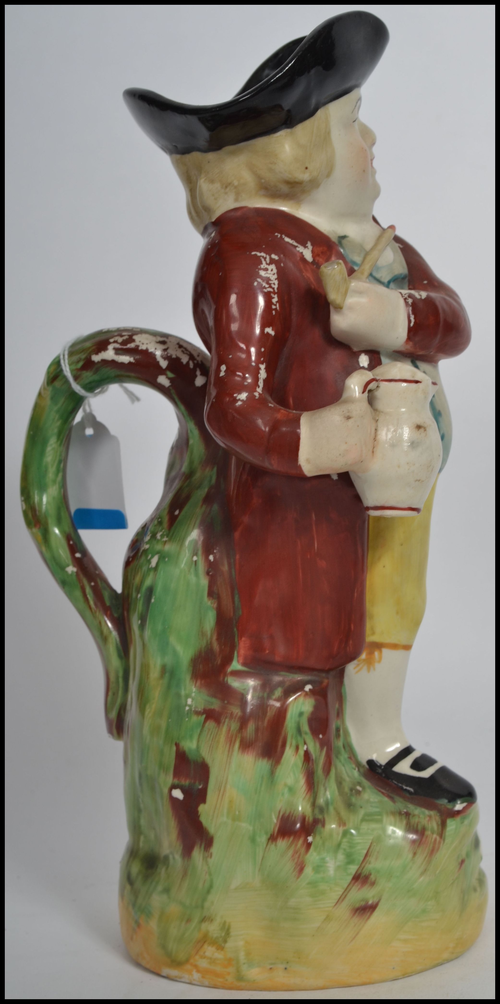 An early 19th century Pratt - type Staffordshire Toby jug of a man in a tricorn hat with pipe and - Image 2 of 5