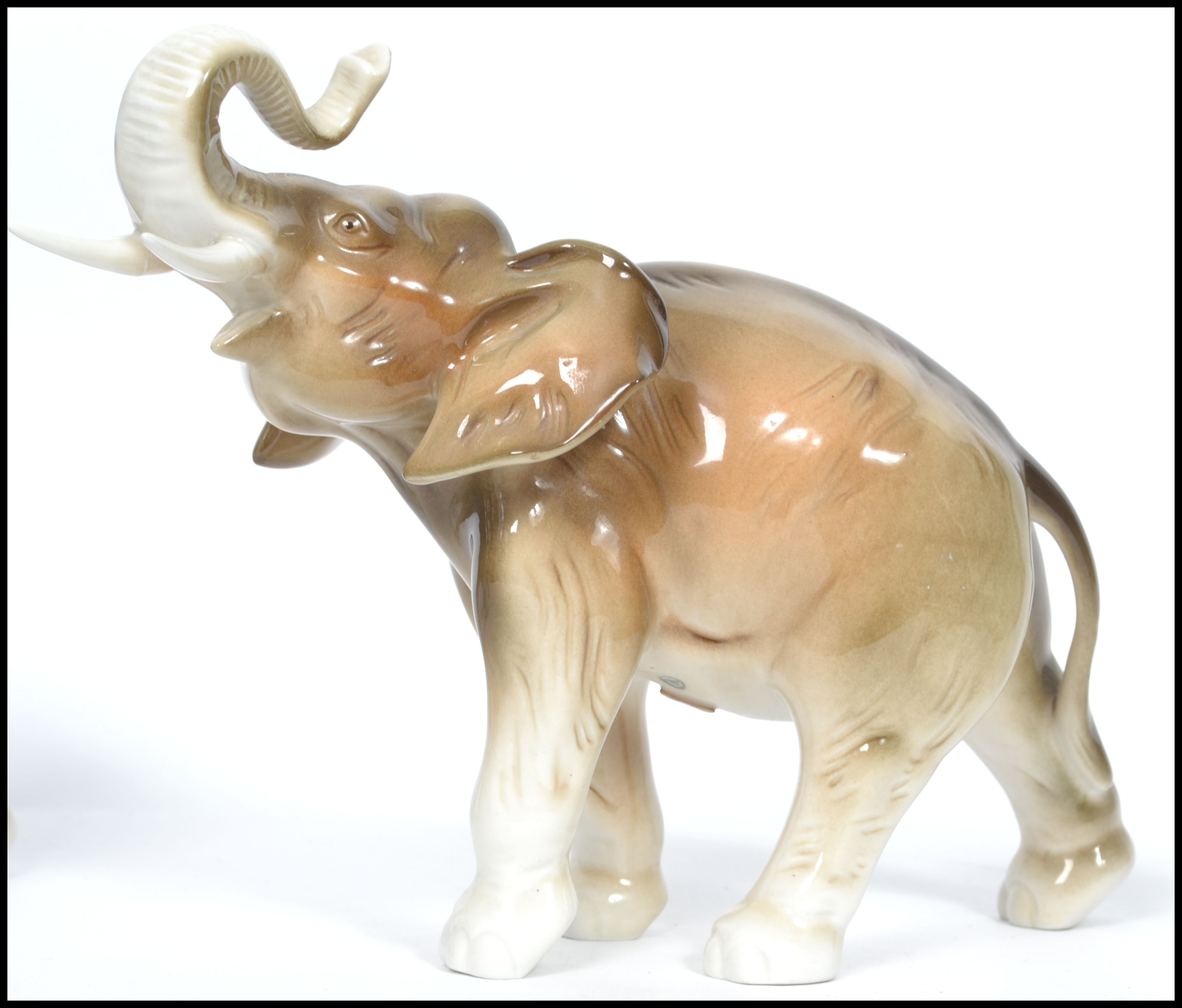A graduating set of three Royal Dux ceramic elephants with applied pink lozenges to base. The - Image 3 of 8