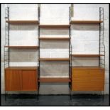 A retro 20th century Ladderax style three bay modular sectional wall system consisting of a series