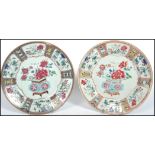 A pair of 18th century import Chinoiserie cabinet plates each with a central decorated panel.