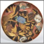 A stunning 18th century Japanese Imari cabinet plate depicting a gilt fighting cock amongst fauna