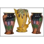 A pair of H and K Tunstall seasonal vases of tapering form with waisted and flared rims along with a