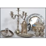 A collection of silver plated wares to include candelabra, large lidded dish with ladel, , table