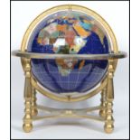 A large 20th century spherical globe having Lapis Lazuli inlay and inset semi precious stone