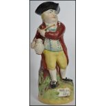An early 19th century Pratt - type Staffordshire Toby jug of a man in a tricorn hat with pipe and