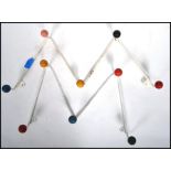 A pair of retro 1950's atomic / sputnik style wall mounted coat racks with colourful finial ends