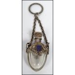 A continental silver white metal perfumer bottle / Holy water bottle on chain decorated with dragons