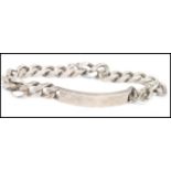 A silver ( stamped 925 ) identity bracelet, the central identity plate flanked by silver curb link