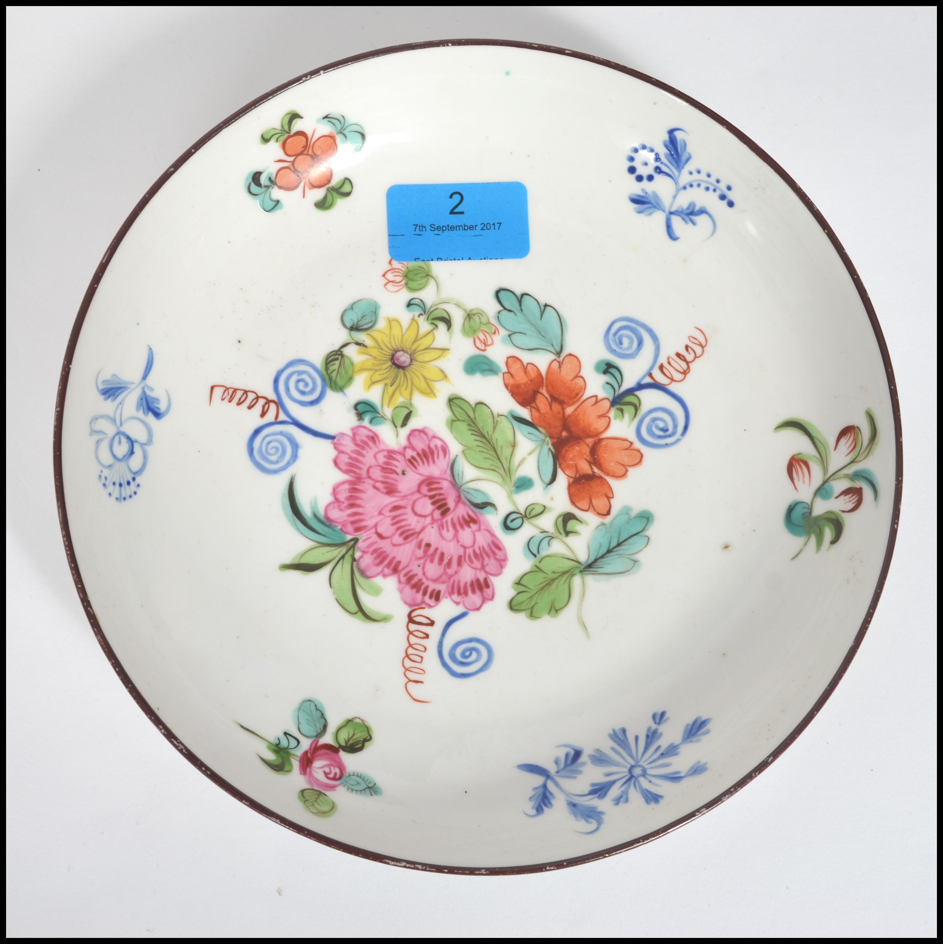 A believed early 19th century New Hall (Newhall) ceramic saucer dish with a central hand painted