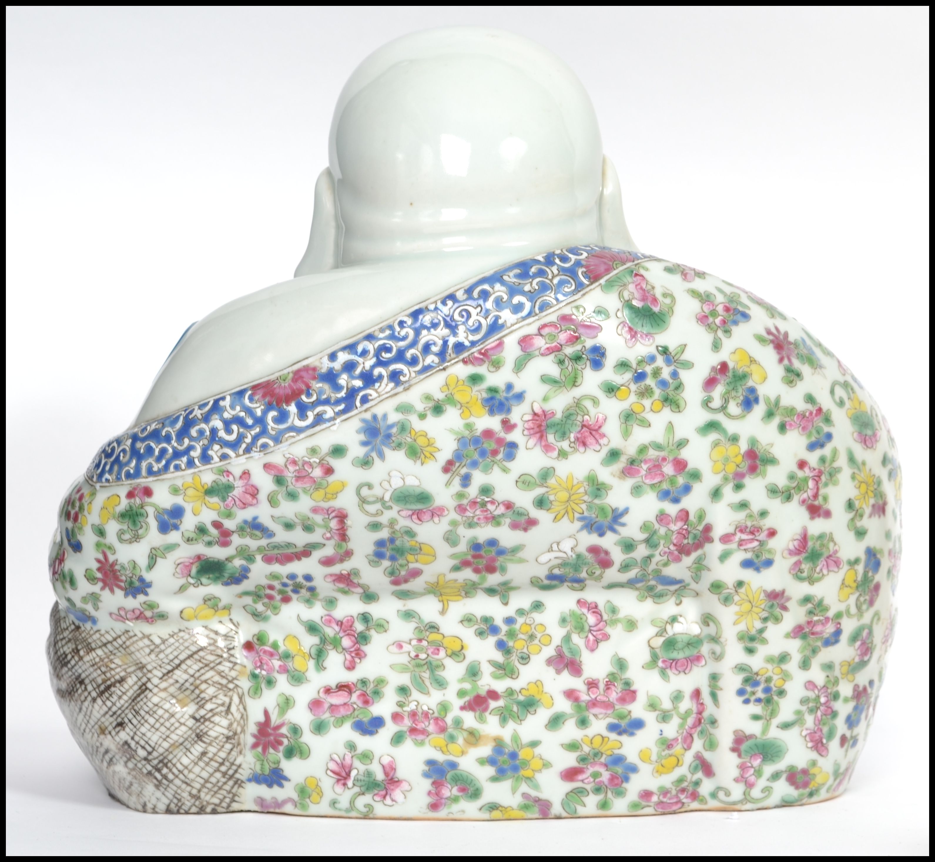 An Oriental ceramic large seated laughing Buddha decorated in famille rose patterned robes holding - Image 6 of 8