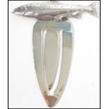 A gentlemans / ladies 20th century silver bookmark of sabre form adorned with a fish finial (