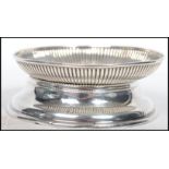 A hallmarked silver Victorian pin dish with ribbed decoration hallmarked for London 1886 by Thomas