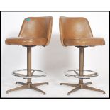 A pair of American style bar stools, in the manner