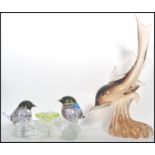 A 20th century studio art glass naturalistic bird figurine group by Murano depicting two birds and