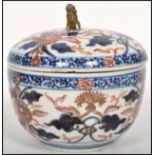 A Kang Hsi Oriental Chinese Imari jar and cover with gilt temple lion / dog of Fu finial to top with