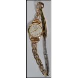 A vintage 9ct gold ladies watch ( serial number 311098 ) by record in the original case on a