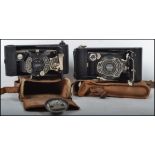 Two vintage 20th century fold out cameras, one being an Ensign Pocket All Distance Synchro A