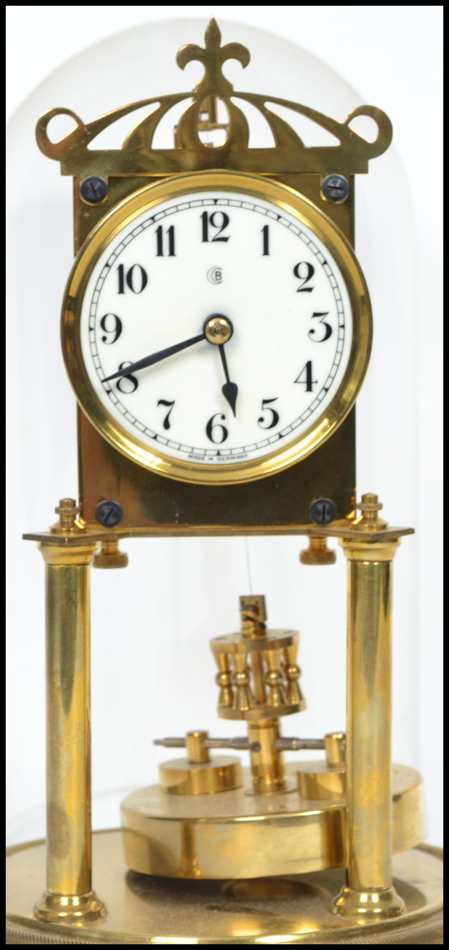 A 20th century glass domed brass anniversary clock raised on a stepped circular base with twin - Image 2 of 4