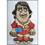 A vintage rugby union memorabilia Grogg figurine of Wales player Jones the Jinx with signature for