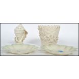 A collection of four pieces of Bone China Belleek porcelain, to include two scalloped dishes, one